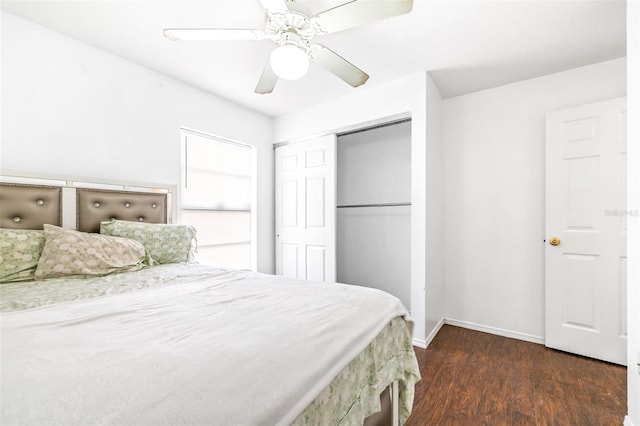 bedroom with a closet, dark wood-style flooring, baseboards, and a ceiling fan