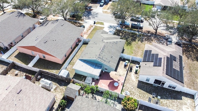 birds eye view of property with a residential view