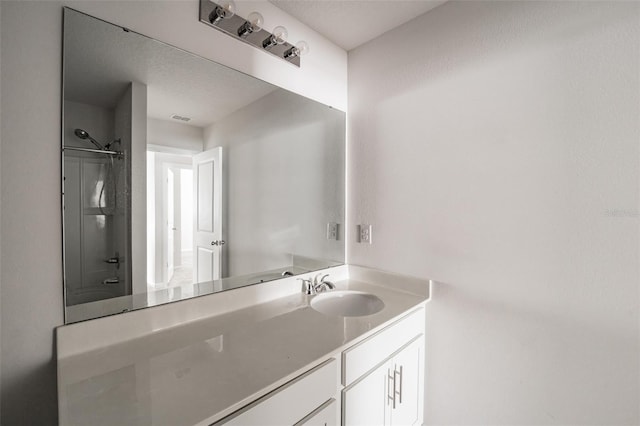 bathroom with visible vents and vanity