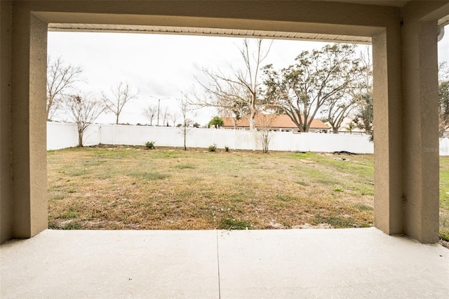 view of yard featuring a patio area and a fenced backyard