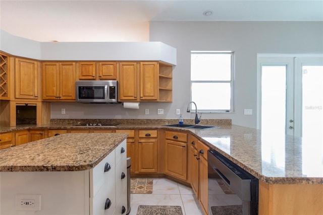 kitchen featuring light stone countertops, open shelves, a sink, wine cooler, and stainless steel microwave