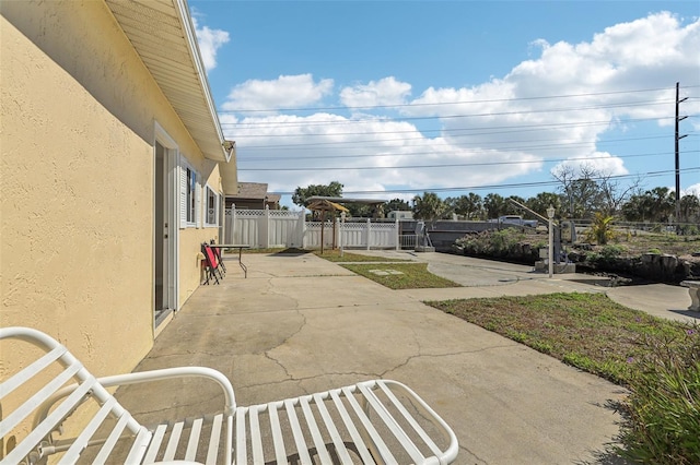 view of patio with fence