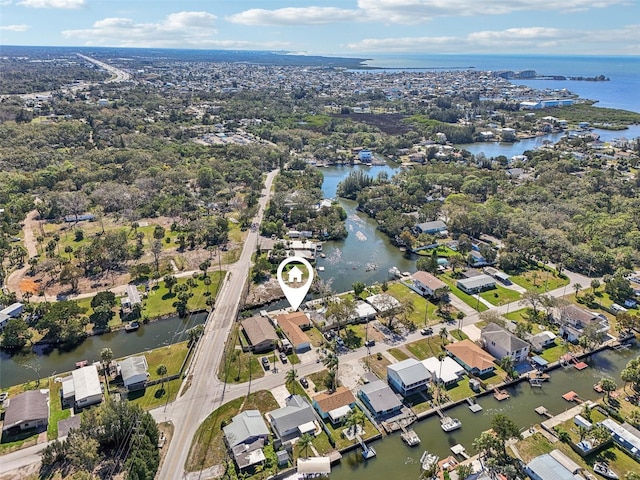 drone / aerial view featuring a water view and a residential view