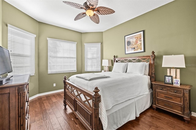 bedroom featuring dark wood-style floors, baseboards, and a ceiling fan