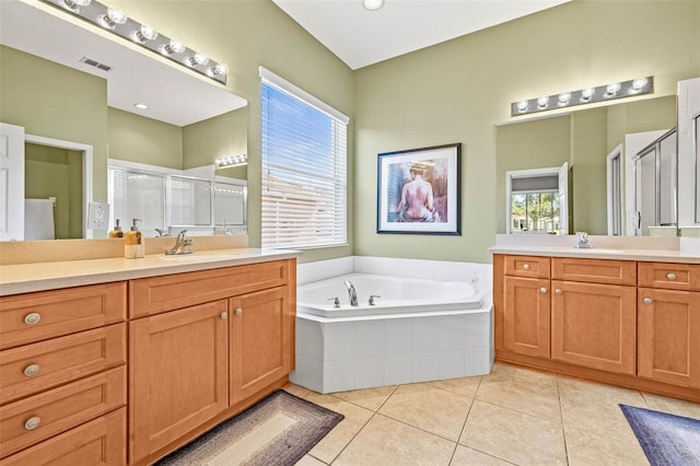 full bath with a garden tub, visible vents, a stall shower, a sink, and tile patterned flooring