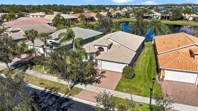 bird's eye view with a water view and a residential view