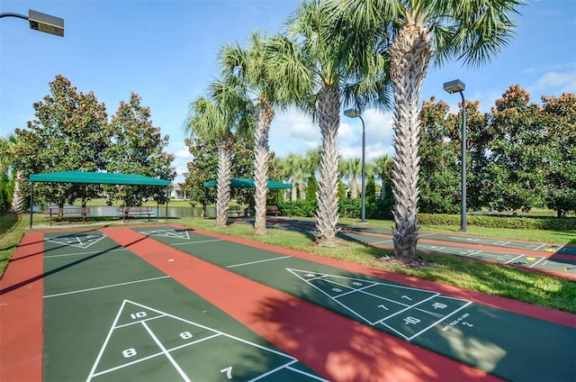 view of property's community featuring shuffleboard