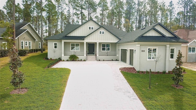 view of front of property featuring decorative driveway, a garage, covered porch, and a shingled roof