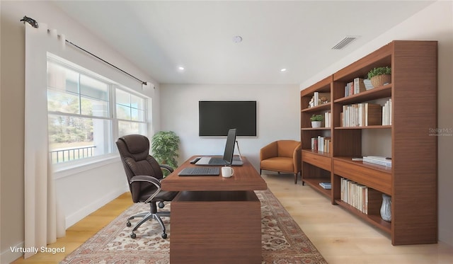 office space featuring recessed lighting, visible vents, and light wood-style flooring