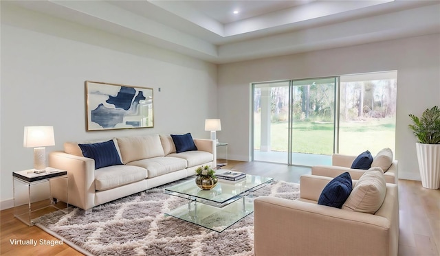 living area with recessed lighting, baseboards, and wood finished floors