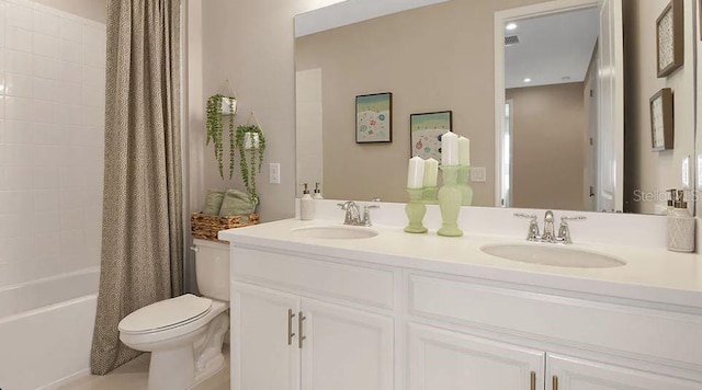 bathroom with toilet, double vanity, a sink, and shower / bath combo with shower curtain