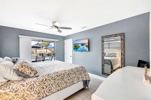 bedroom featuring light tile patterned floors, ceiling fan, visible vents, and baseboards