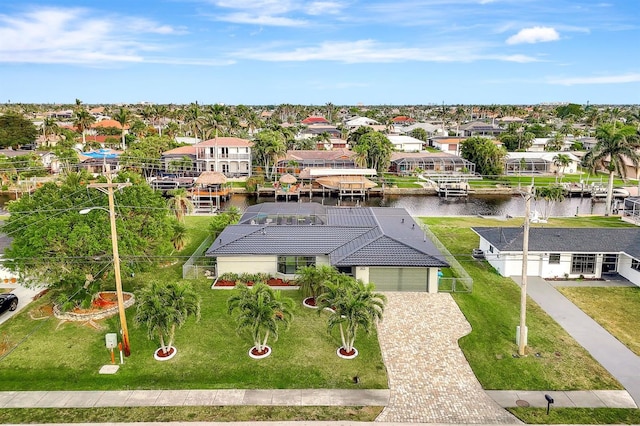 bird's eye view featuring a residential view and a water view