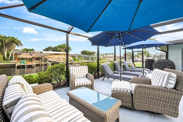 view of patio / terrace with a water view and an outdoor living space