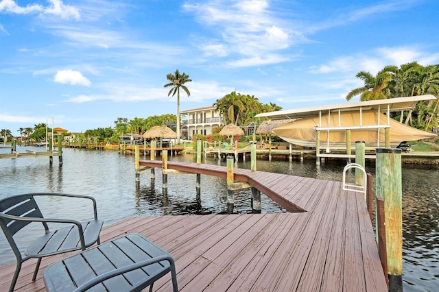 dock area featuring a water view and boat lift