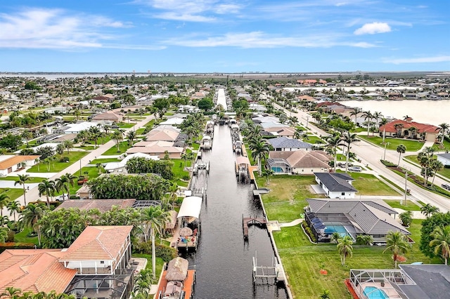 birds eye view of property featuring a residential view and a water view