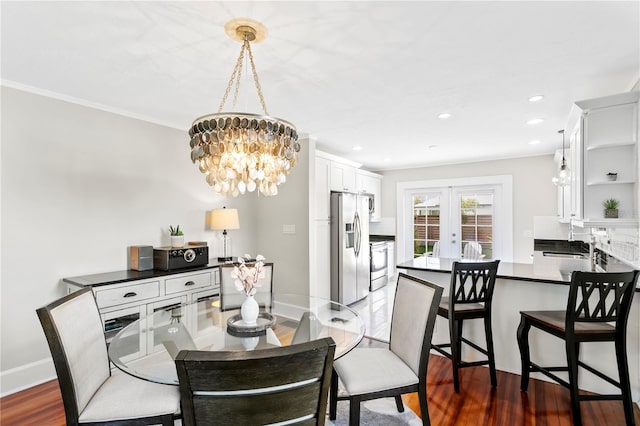 dining room featuring baseboards, dark wood finished floors, french doors, a notable chandelier, and recessed lighting