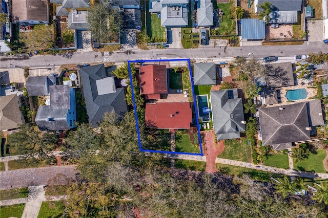 birds eye view of property with a residential view