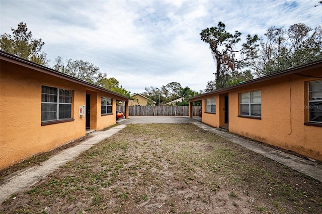 view of yard with a patio and fence