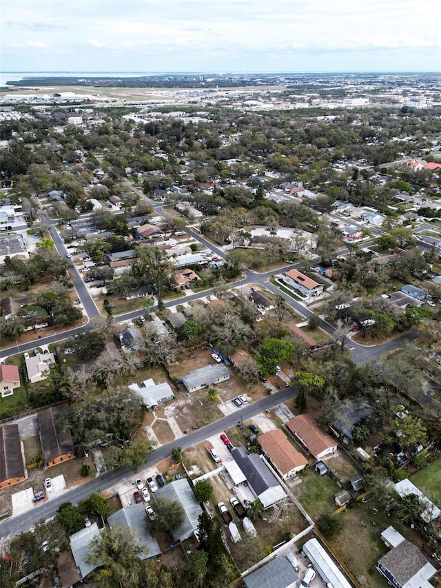 birds eye view of property featuring a water view and a residential view