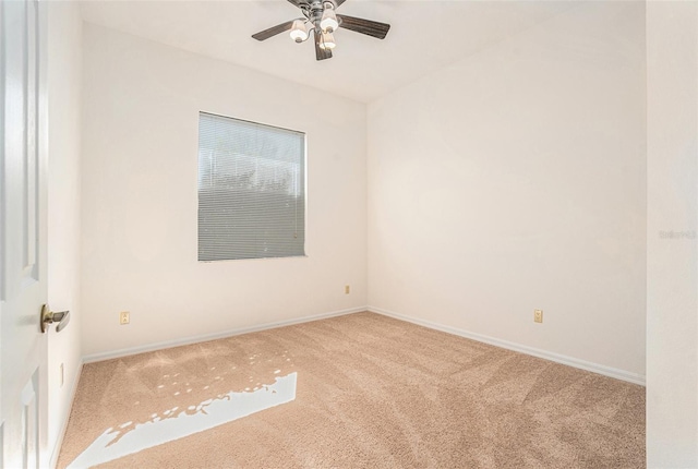 unfurnished room featuring carpet floors, ceiling fan, and baseboards