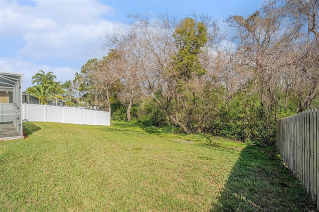 view of yard with a fenced backyard