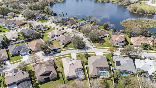 birds eye view of property with a residential view and a water view