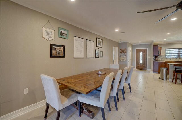 dining area featuring ornamental molding, light tile patterned flooring, recessed lighting, and baseboards