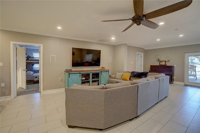 living area with ornamental molding, recessed lighting, and baseboards