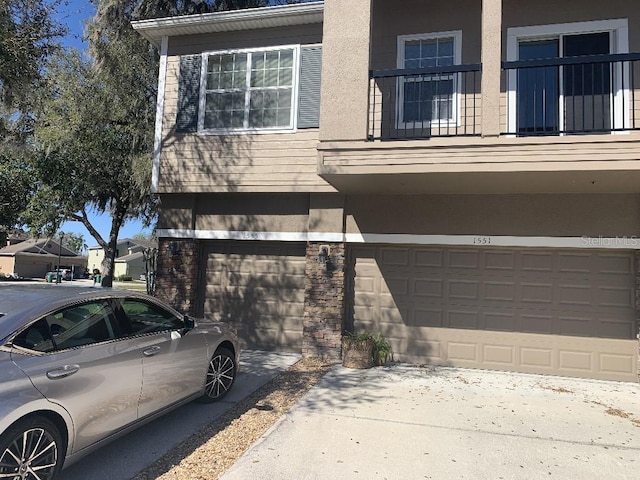 view of home's exterior featuring an attached garage and stucco siding