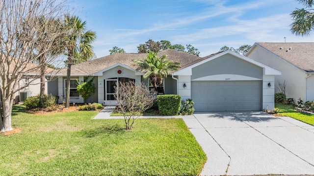 single story home featuring a garage, driveway, a front lawn, and stucco siding