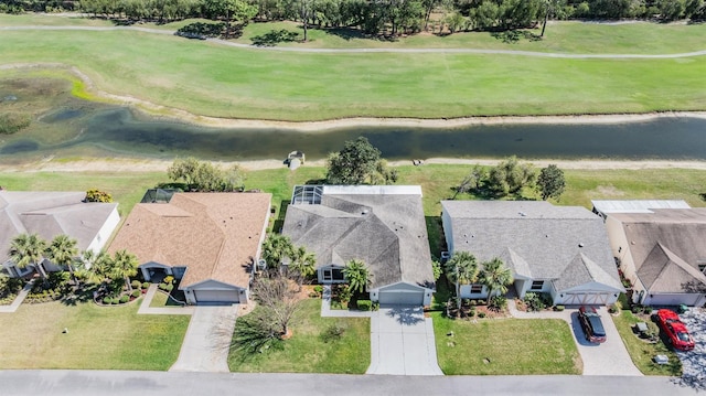 bird's eye view featuring a residential view and a water view