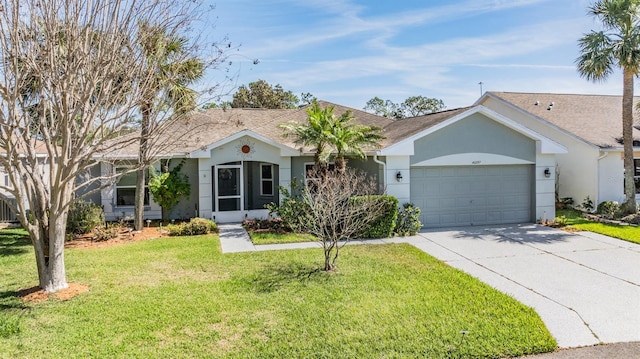 ranch-style home with an attached garage, a front lawn, concrete driveway, and stucco siding