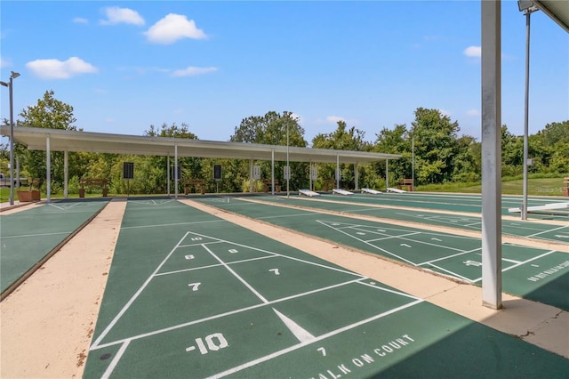 view of property's community featuring shuffleboard