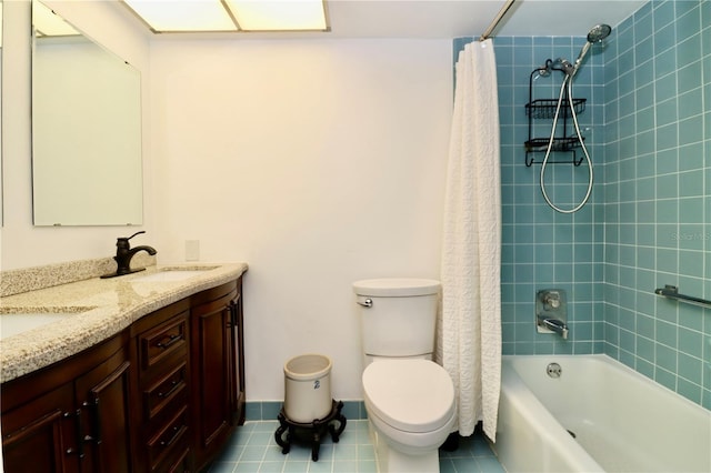 2630 Pearce Dr Unit 107, Clearwater, FL 33764 - bathroom featuring tile patterned floors, toilet, a sink, shower / bath combo, and double vanity