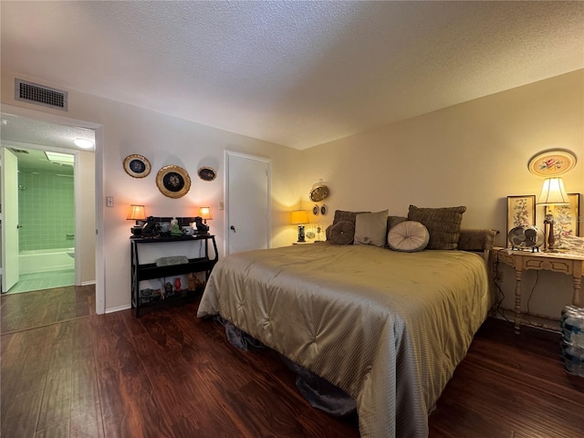 2630 Pearce Dr Unit 107, Clearwater, FL 33764 - bedroom featuring visible vents, wood finished floors, and a textured ceiling