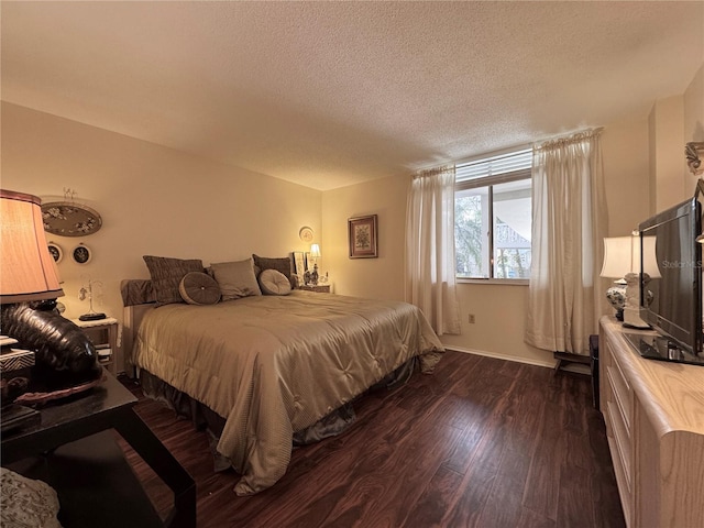 2630 Pearce Dr Unit 107, Clearwater, FL 33764 - bedroom featuring dark wood-type flooring and a textured ceiling