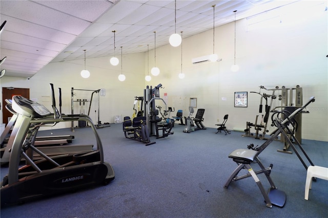 2630 Pearce Dr Unit 107, Clearwater, FL 33764 - workout area featuring lofted ceiling and a wall mounted air conditioner