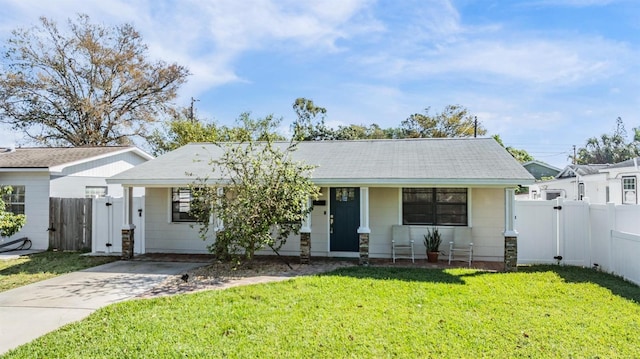 single story home featuring fence private yard, a gate, and a front lawn