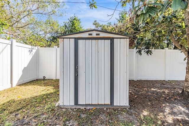 view of shed with a fenced backyard