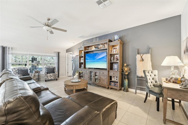 living area with light tile patterned floors, ceiling fan, lofted ceiling, visible vents, and baseboards