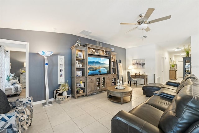 living area with visible vents, vaulted ceiling, a ceiling fan, and light tile patterned flooring