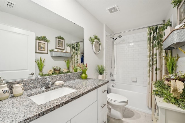 full bath with shower / bath combo, visible vents, toilet, tile patterned floors, and vanity