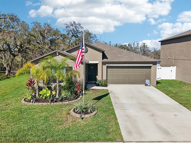 ranch-style home with concrete driveway, an attached garage, a front lawn, and stucco siding