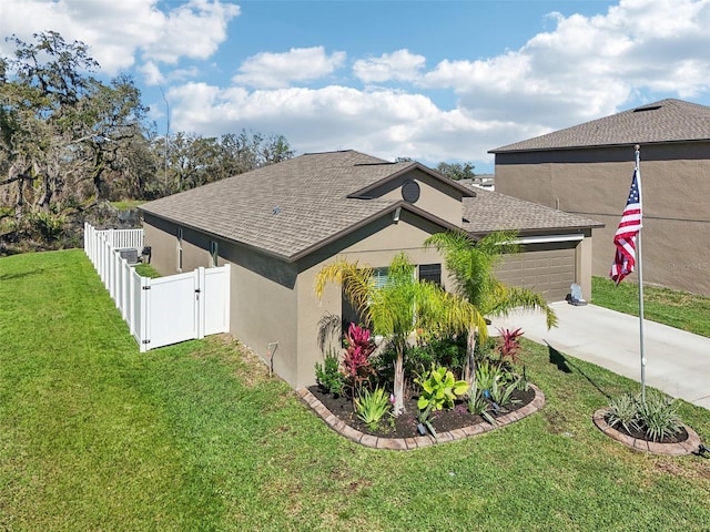 view of side of property with a garage, concrete driveway, a lawn, roof with shingles, and stucco siding