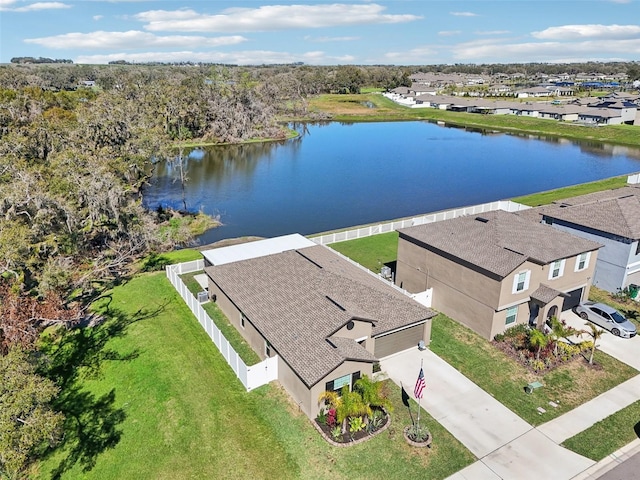 birds eye view of property with a water view