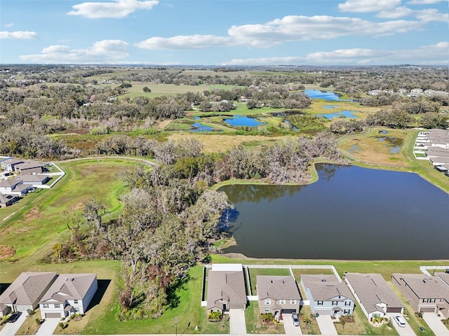 birds eye view of property with a residential view and a water view