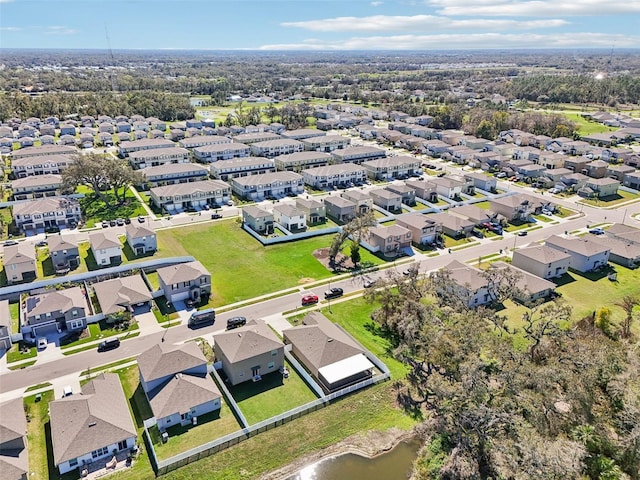 birds eye view of property with a residential view and a water view