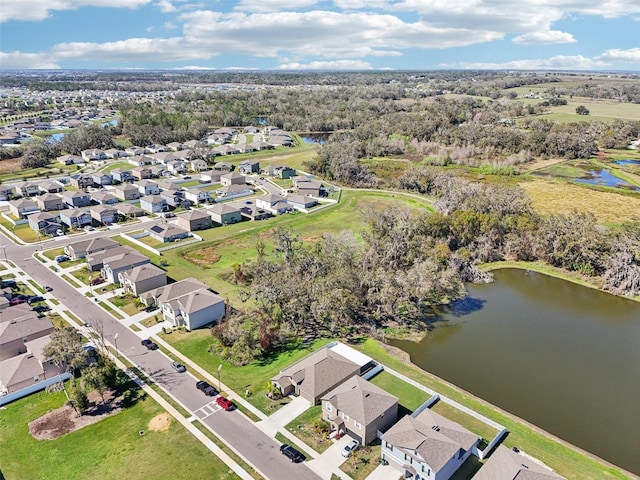 bird's eye view featuring a water view and a residential view