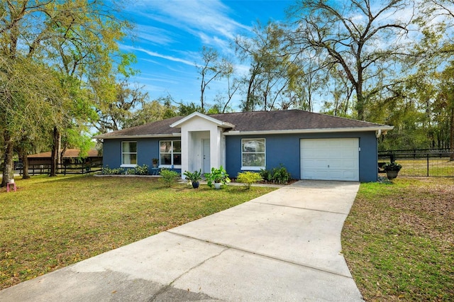 ranch-style house with an attached garage, fence, concrete driveway, stucco siding, and a front yard